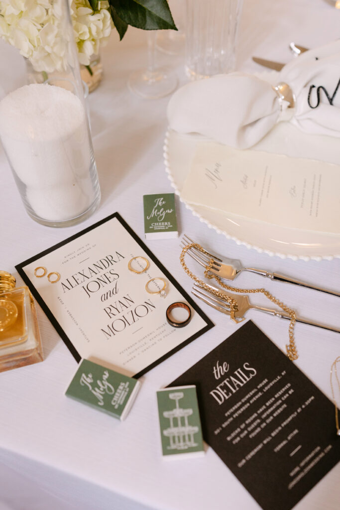 Elegant wedding stationery displayed on reception tablescape at Peterson Dumesnil House in Louisville KY