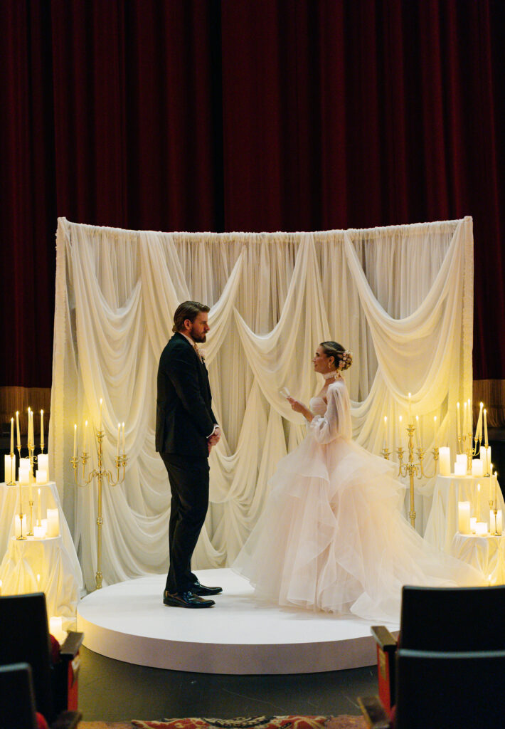 Private vows in the theater at the Louisville Palace during an intimate, Phantom of the Opera inspired wedding in Louisville KY