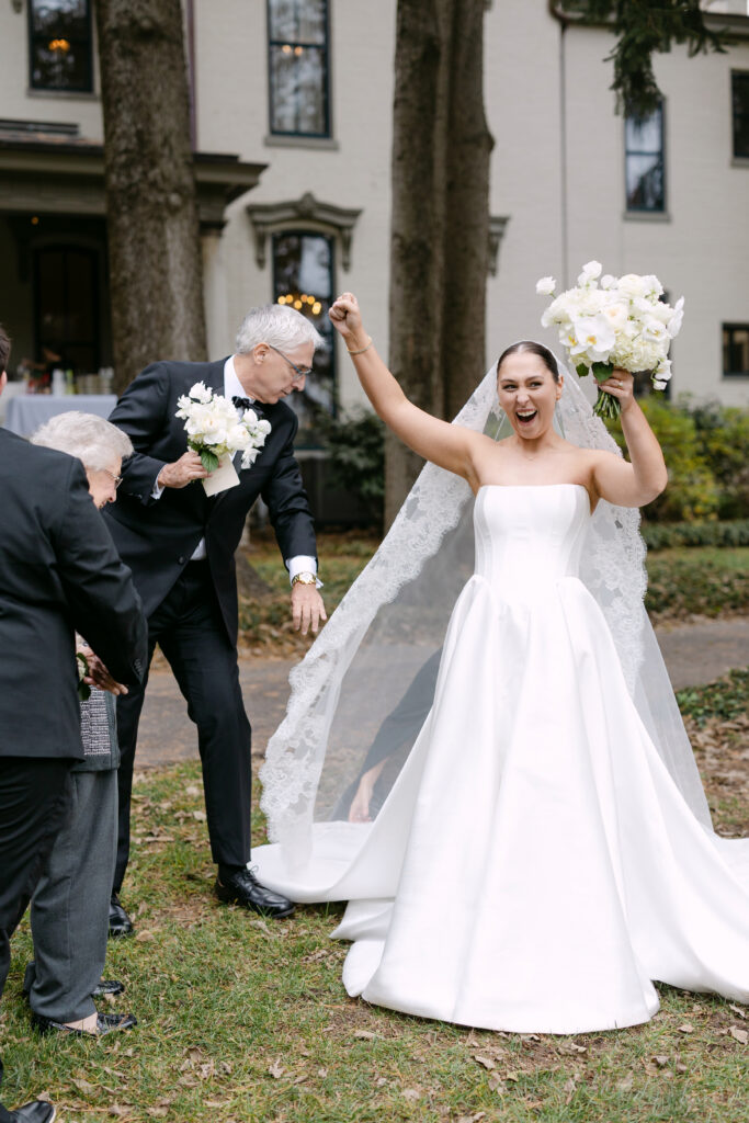 Bride celebrating excitedly after ceremony at Peterson Dumesnil House wedding in Louisville
Bride taking tequila shot on dance floor