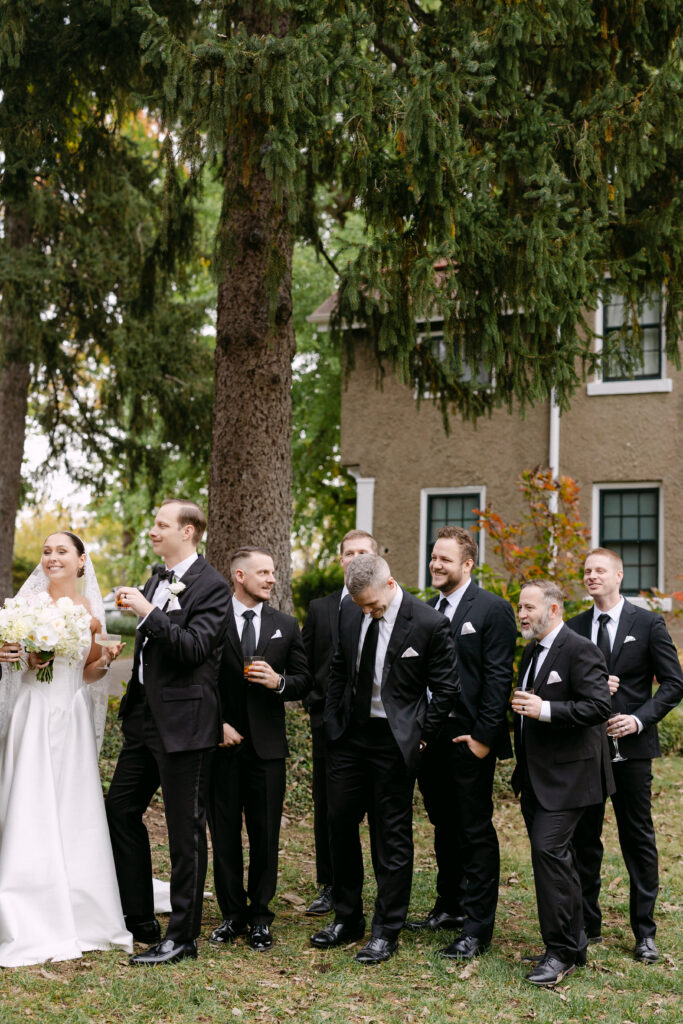Wedding party laughing together at Peterson Dumesnil House wedding in Louisville Kentucky