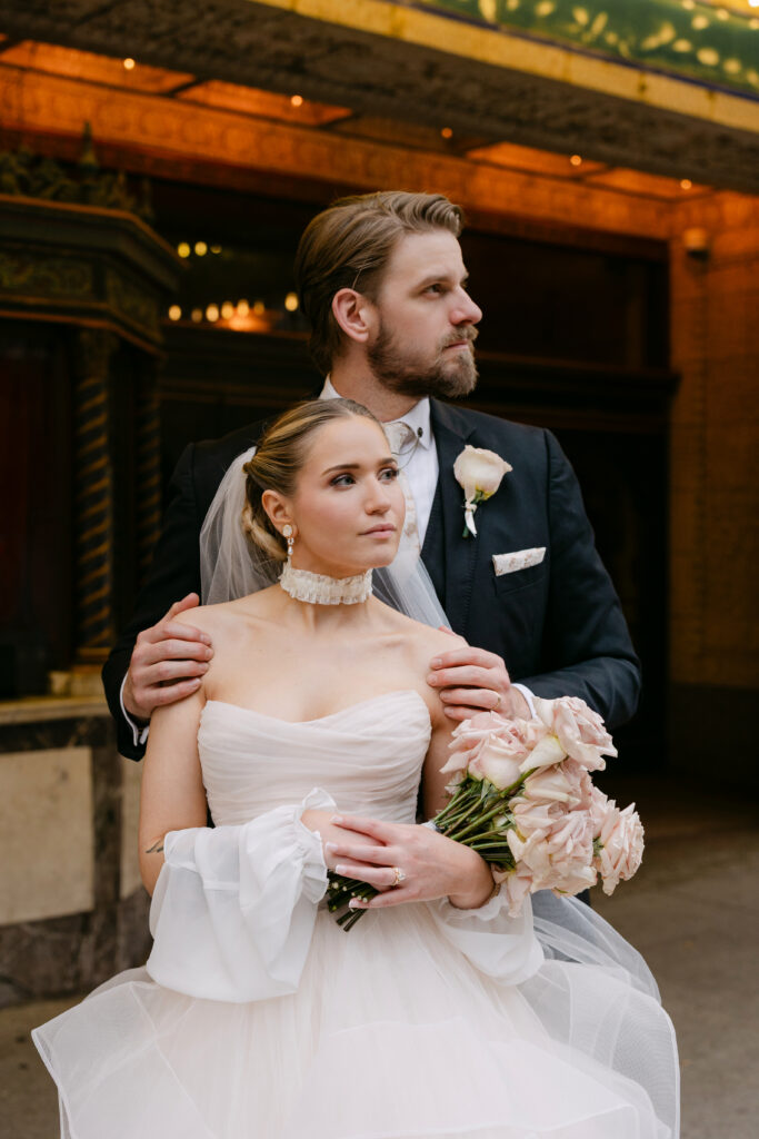 Bride and groom portrait outside the Louisville Palace theater in downtown Louisville Kentucky on their wedding day