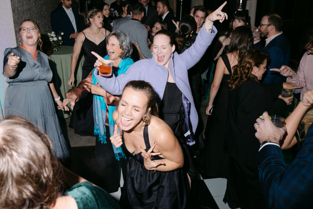 Wedding guest dancing during reception at Peterson Dumesnil House in Louisville KY