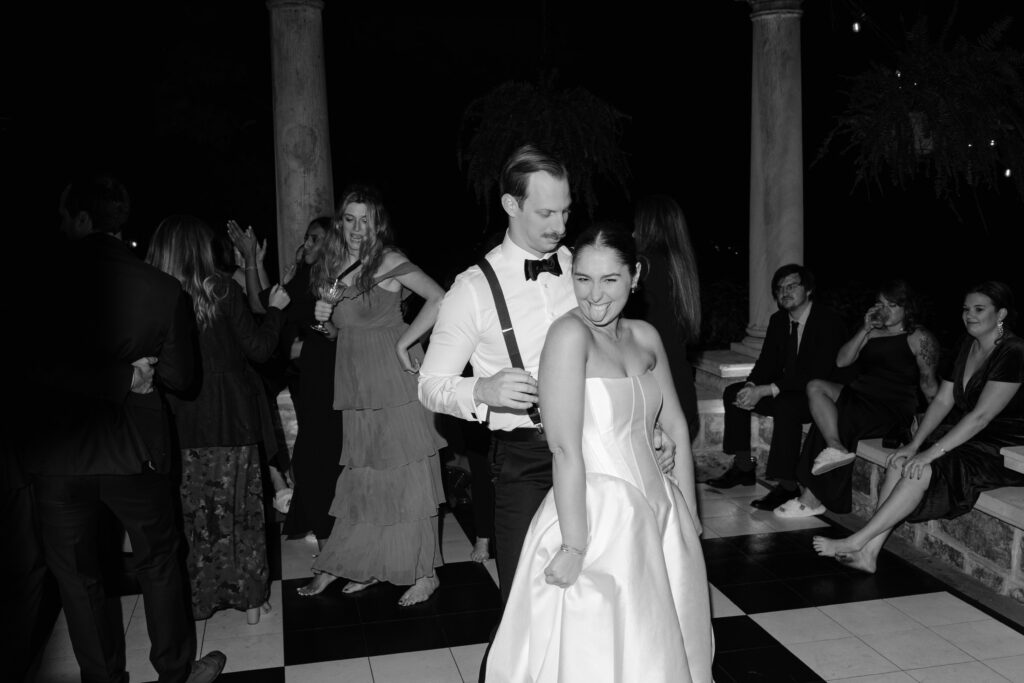 Bride and groom dancing on checkered dance floor at Peterson Dumesnil House wedding reception
