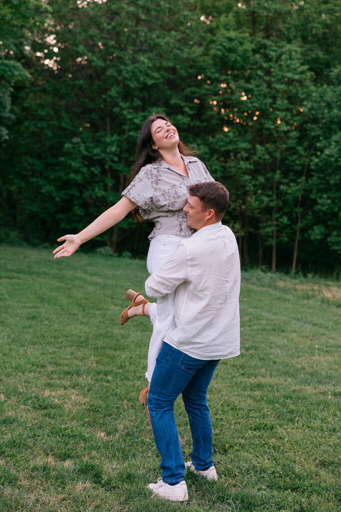 Romantic engagement portraits in Cherokee Park with sunset light through the trees
